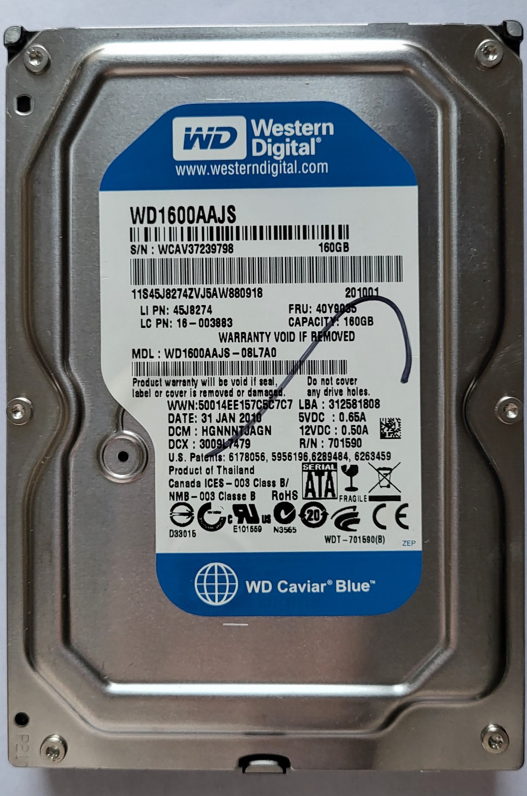 The front of a rectangular, metal-cased Hard Disk Drive box. Western Digital, WD1600AAJs, 160GB, 3.5'' long, Thailand.